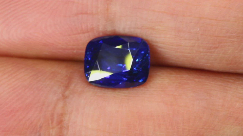 Video of 2.04Ct Royal Blue Sapphire  Cushion Shape from Sri Lanka between fingers