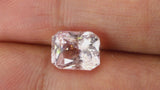 Video of 3.58Ct Light Peach Sapphire | Emerald Shape from Sri Lanka between fingers